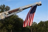 American flag hanging from the MTFD ladder truck. 