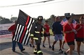 MTFD's Joe Warne starts his 140 mile walk from Macomb Township to Cascade Township. 