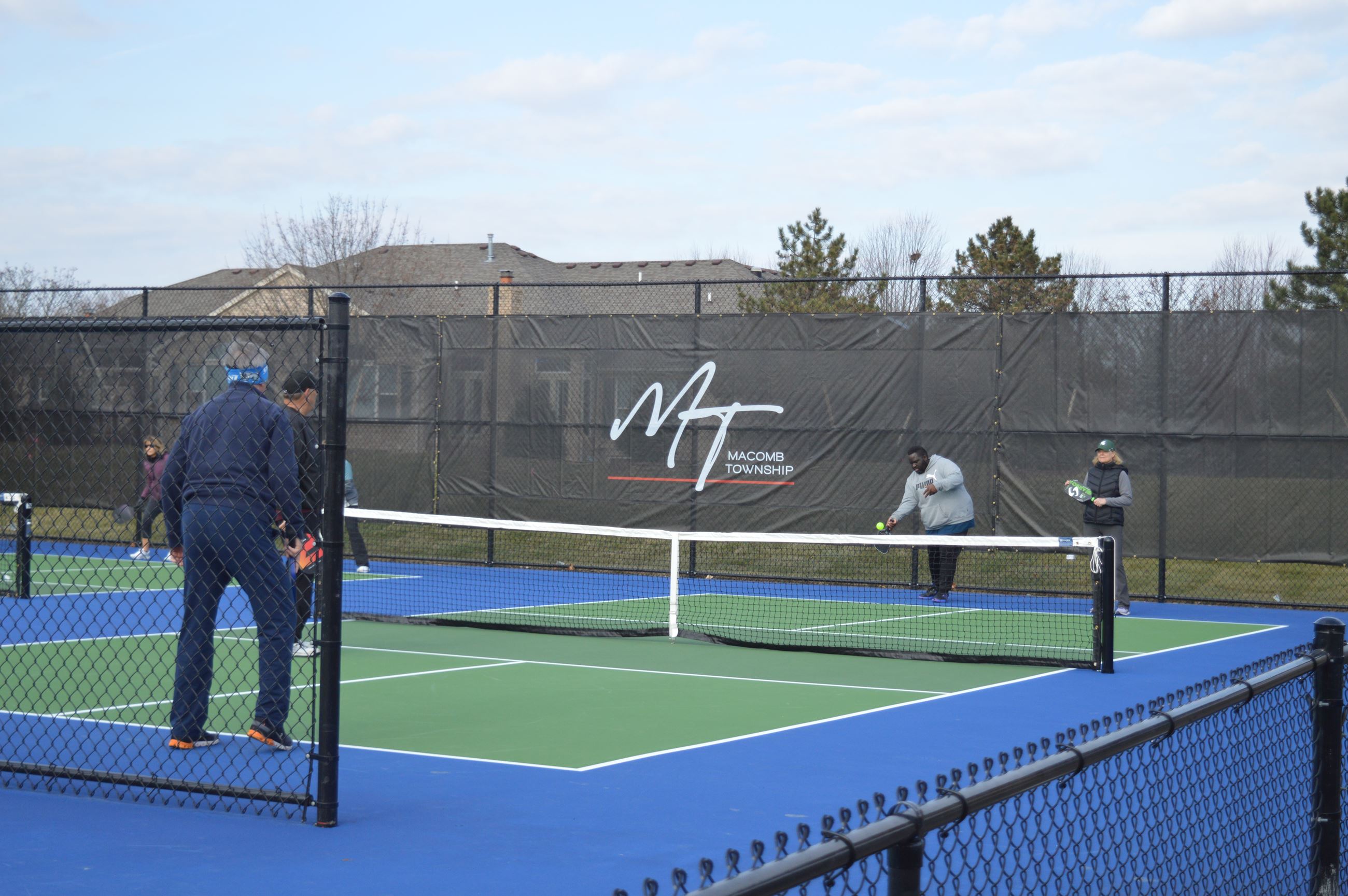 Residents playing pickleball on the pickleball courts 