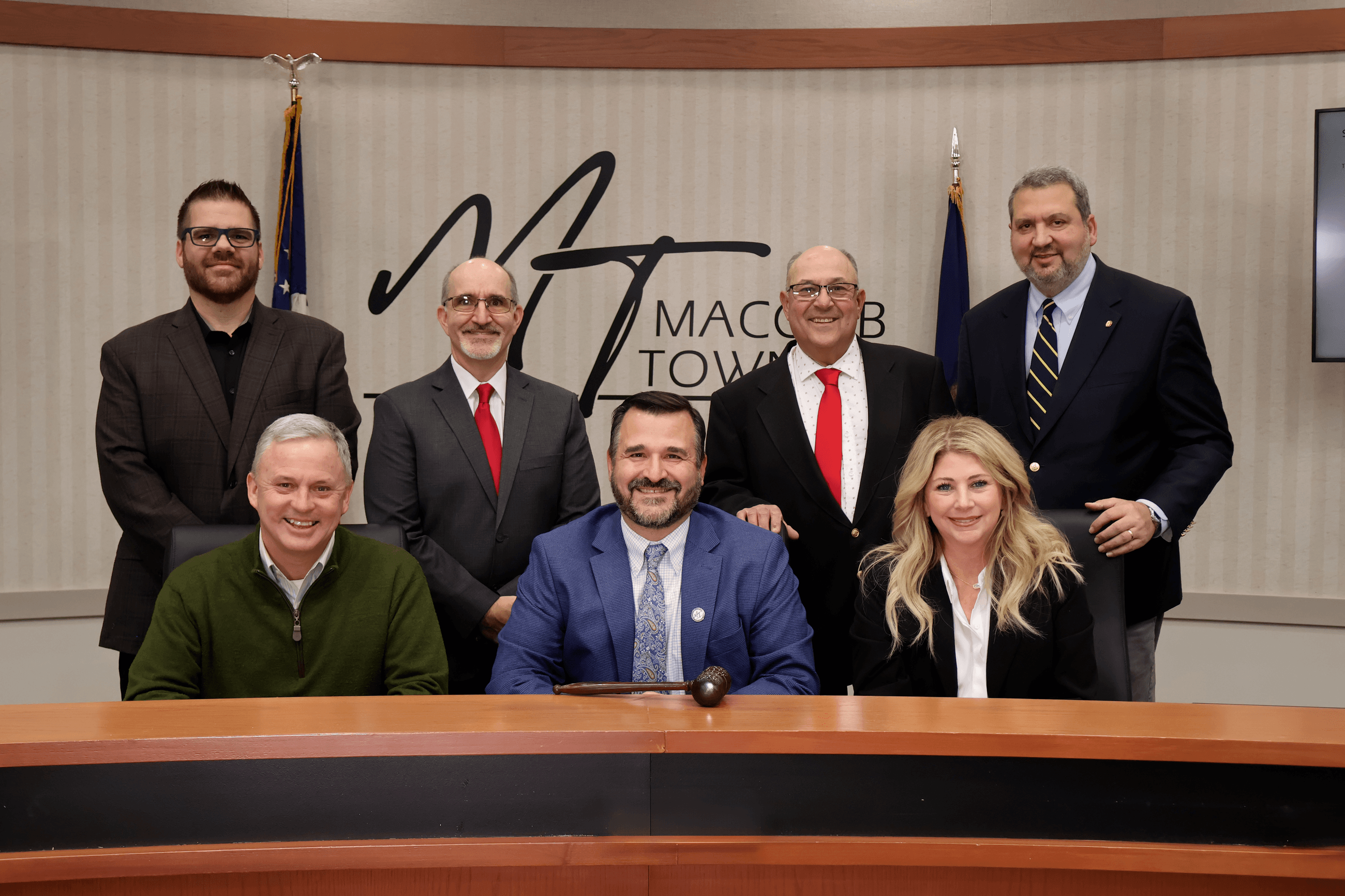 Group photo of the Board of Trustees sitting at the Trustees' table inside the Boardroom. 
